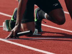 man on running field